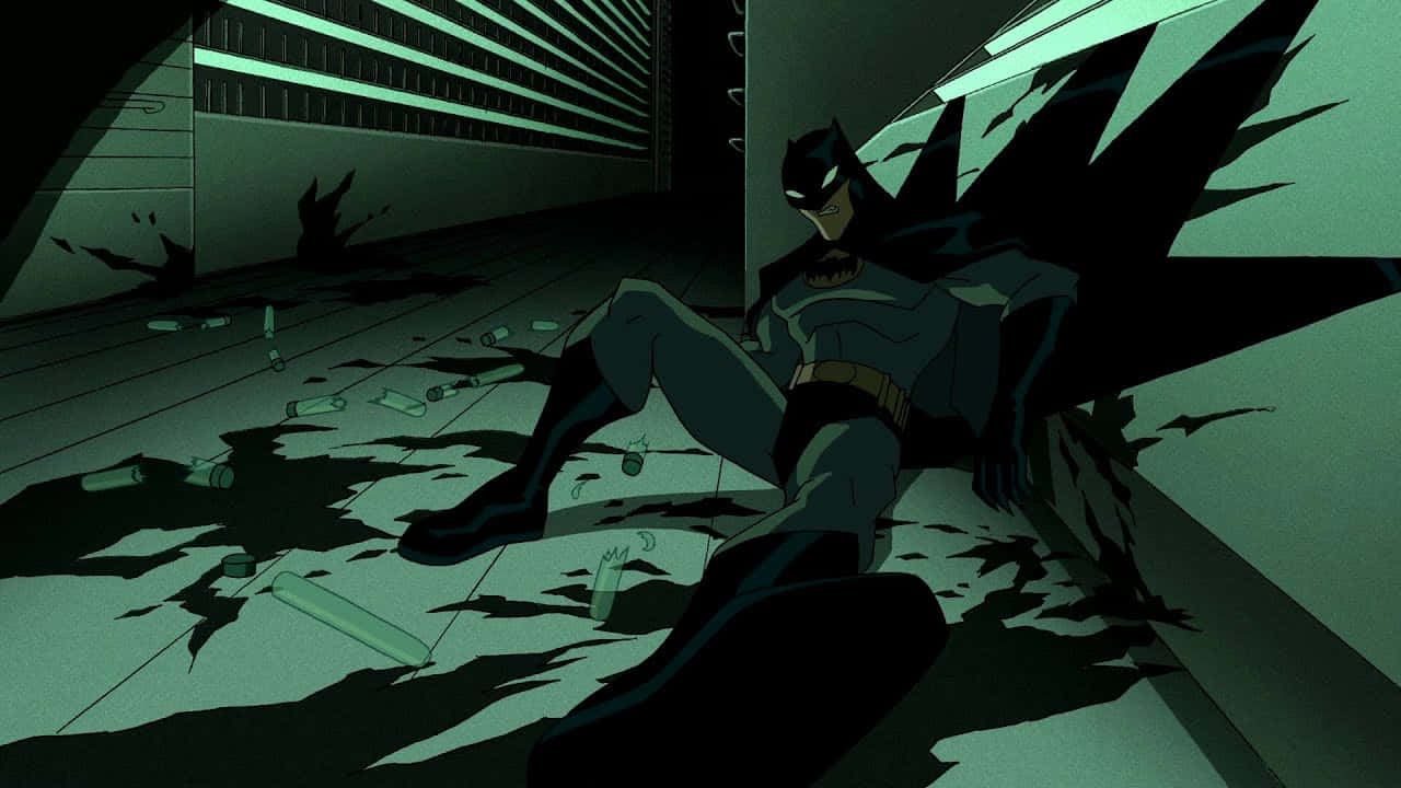 The Batman Vs Dracula 桌布 壁紙 — 蝙蝠俠在陰森綠光下，坐在破碎的小巷中，遍體鱗傷。
