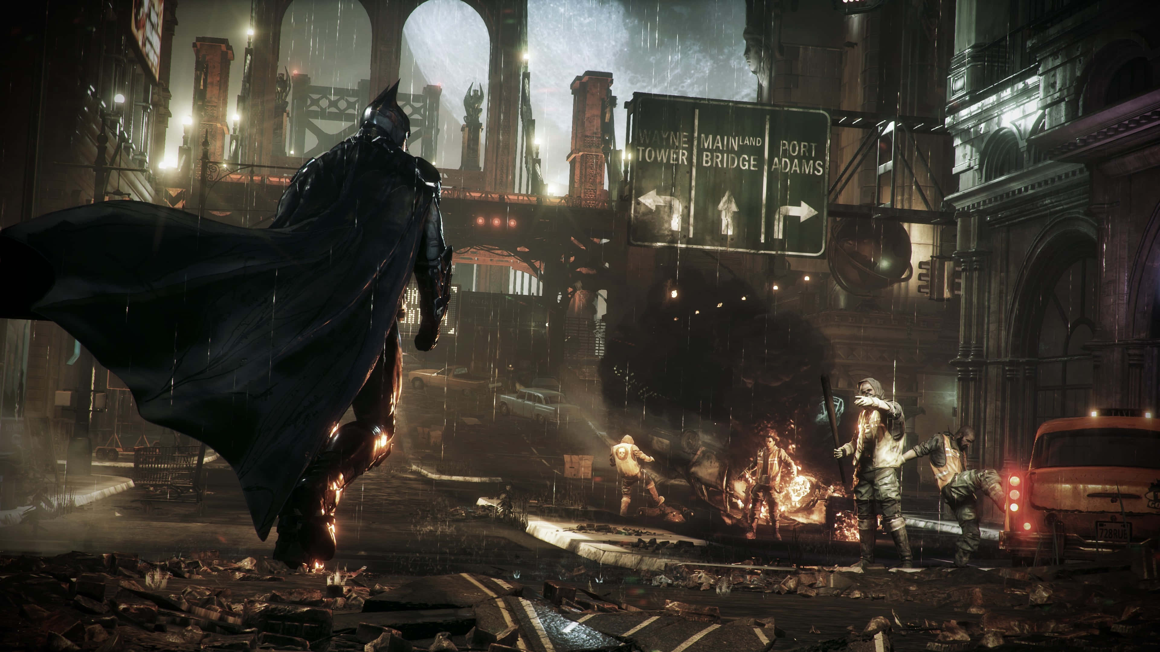 Superhero Video Games 桌布 壁紙 — 蝙蝠俠在雨濕的葛咸城街道上大步前行，月光下罪犯在廢車旁燃燒。