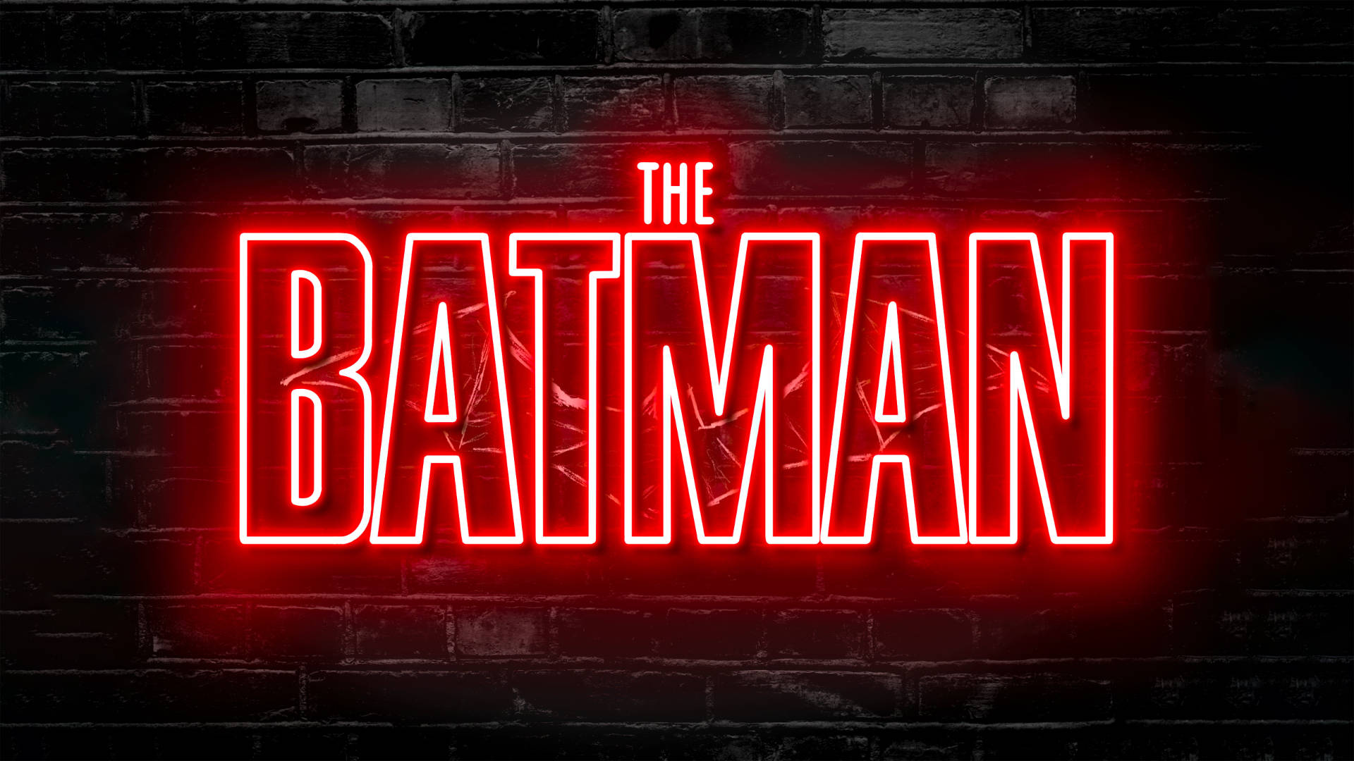 深色磚牆上寫有「THE BATMAN」的紅色霓虹燈牌。