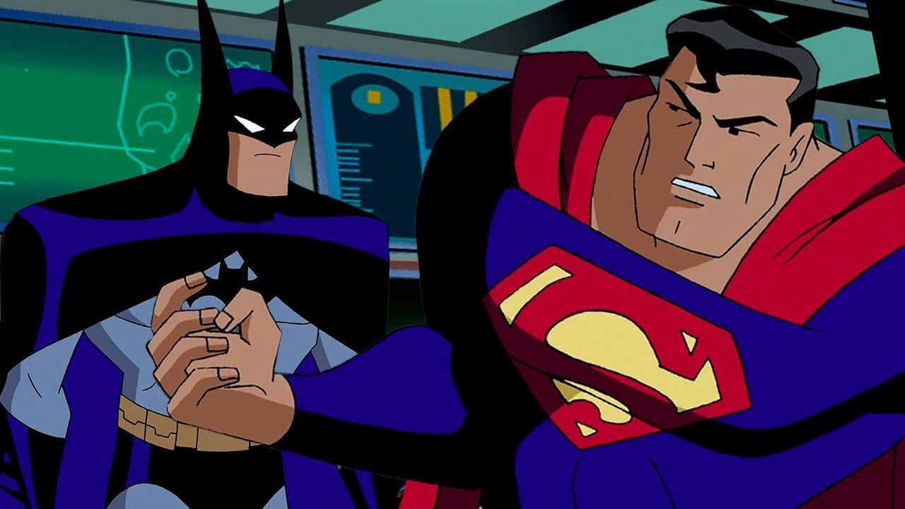 Superman The Animated Series 桌布 壁紙 — 蝙蝠俠與超人喺緊張嘅動畫場景中對峙，背後有發光嘅綠色屏幕。