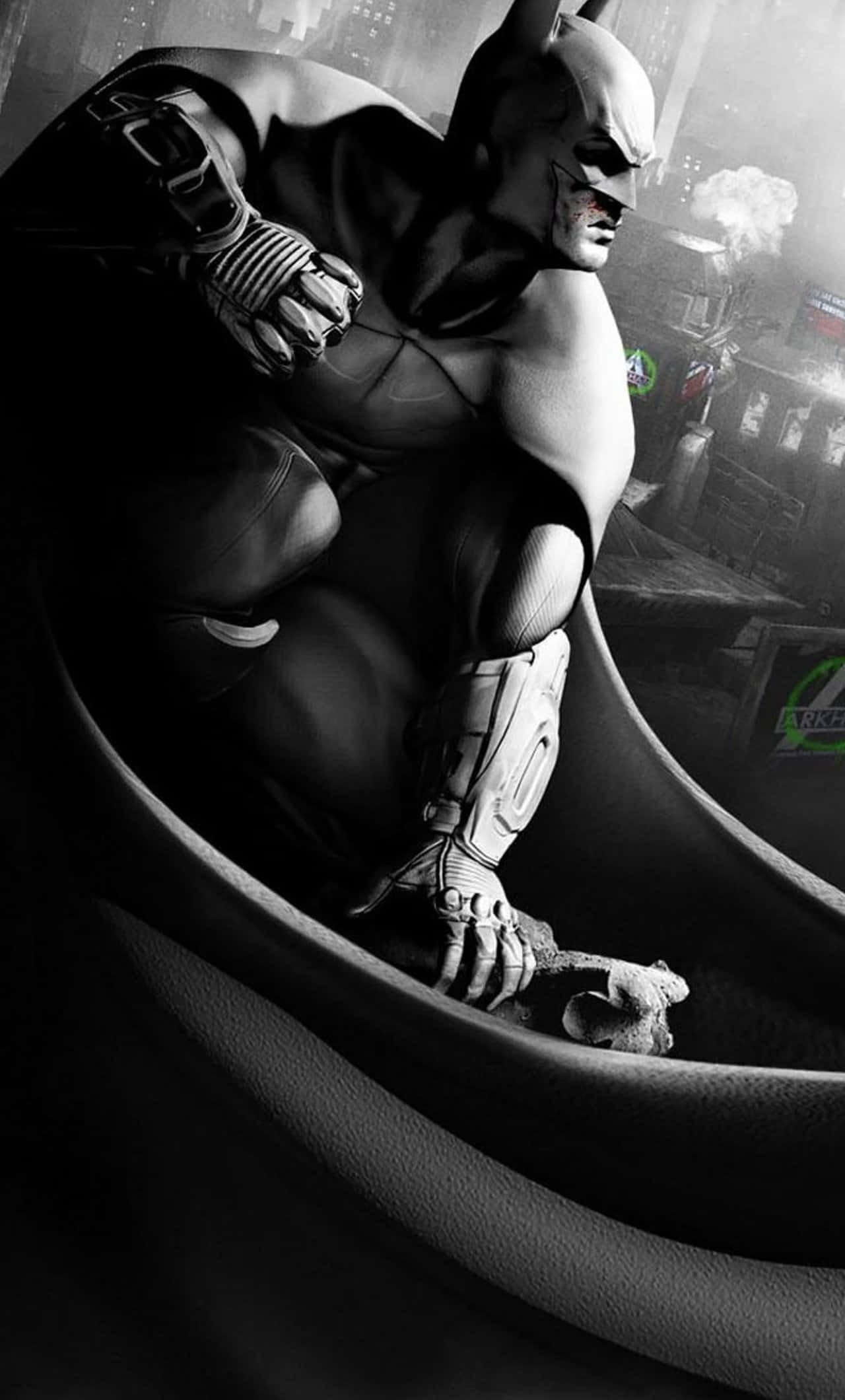 Batman Black And White 桌布 壁紙 — 蝙蝠俠蹲在陰暗的高譚雨中，表情嚴峻，戴著手套的手中握著一個破碎的蝙蝠標誌。