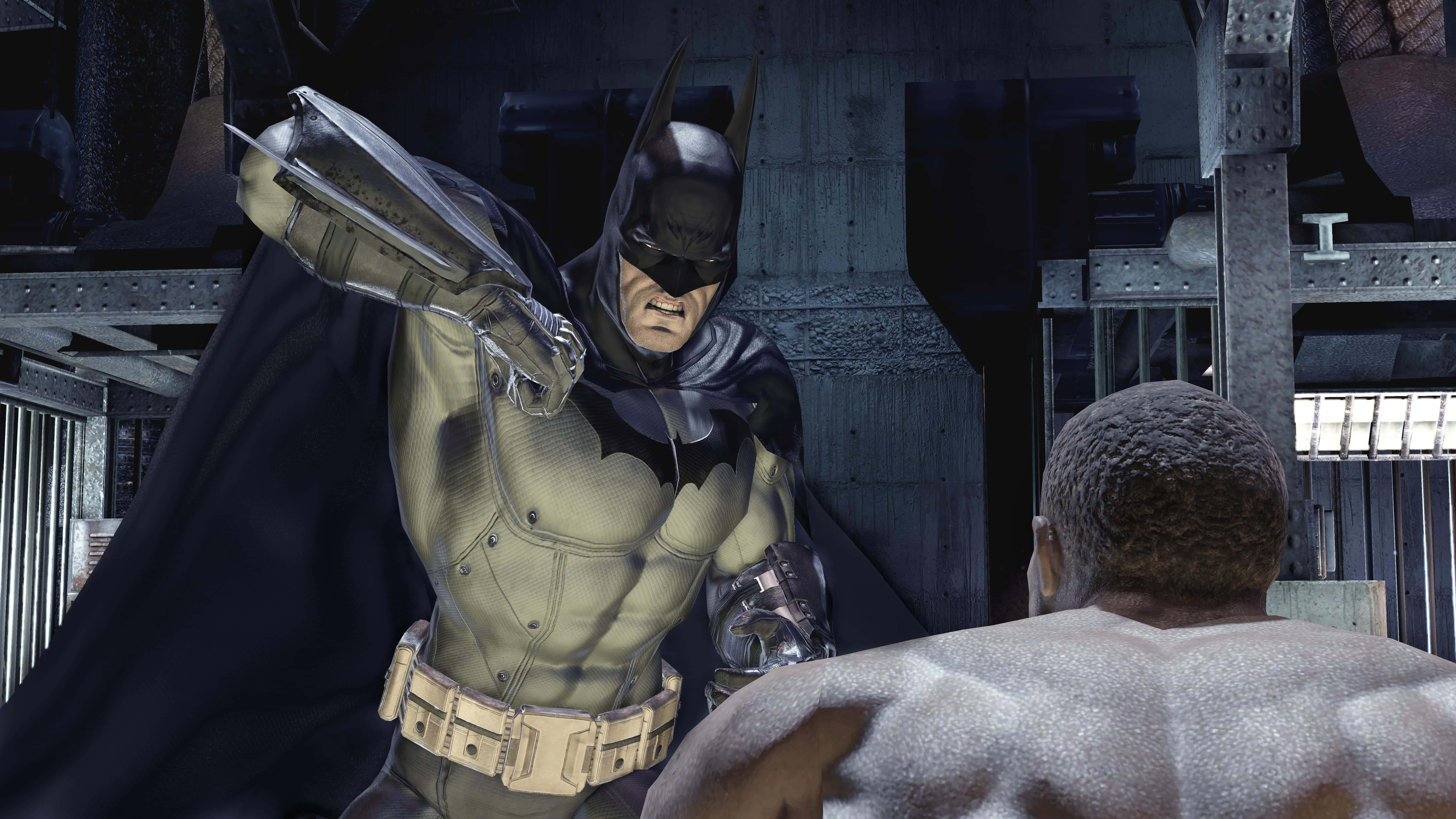 Arkham Asylum 桌布 壁紙 — 蝙蝠俠身穿裝甲服，在鋼樑和昏暗燈光的粗獷工業環境中與一名肌肉男對峙。