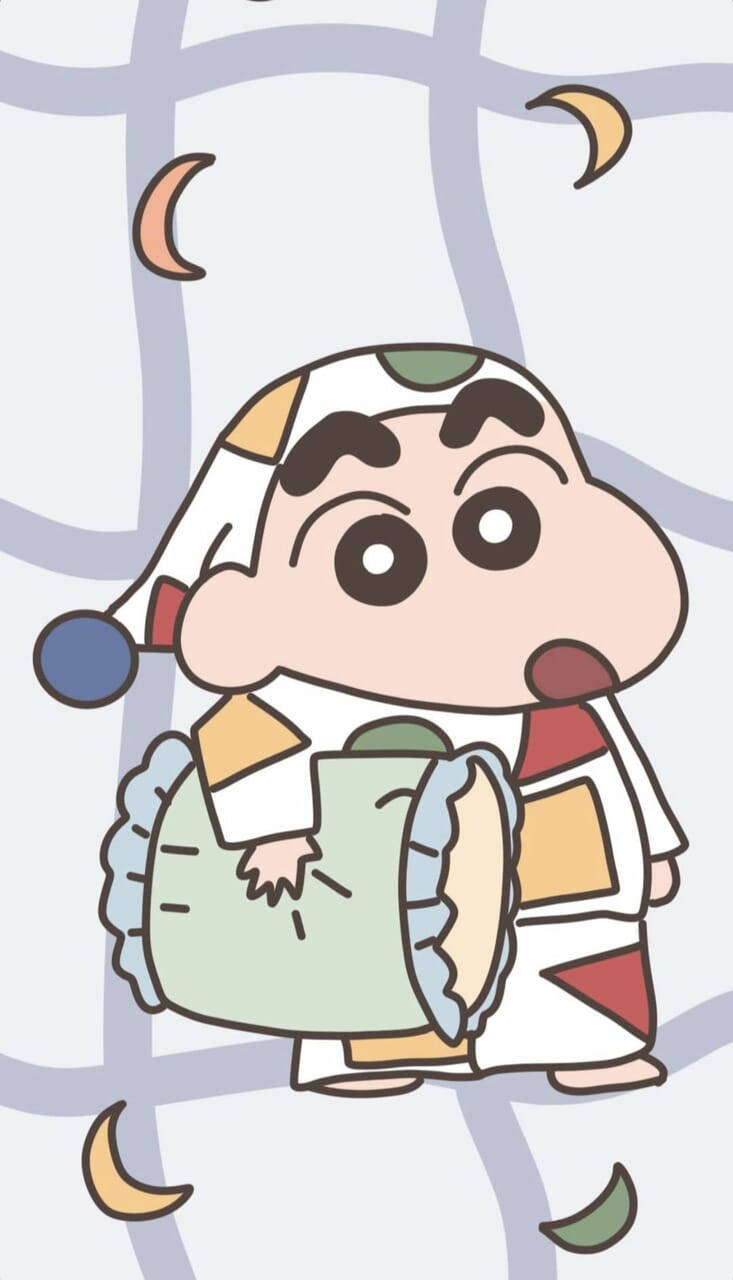 Shin Chan 桌布 壁紙 — 蠟筆小新穿著色彩繽紛的拼布服裝，抱著一個枕頭，周圍有新月漂浮。