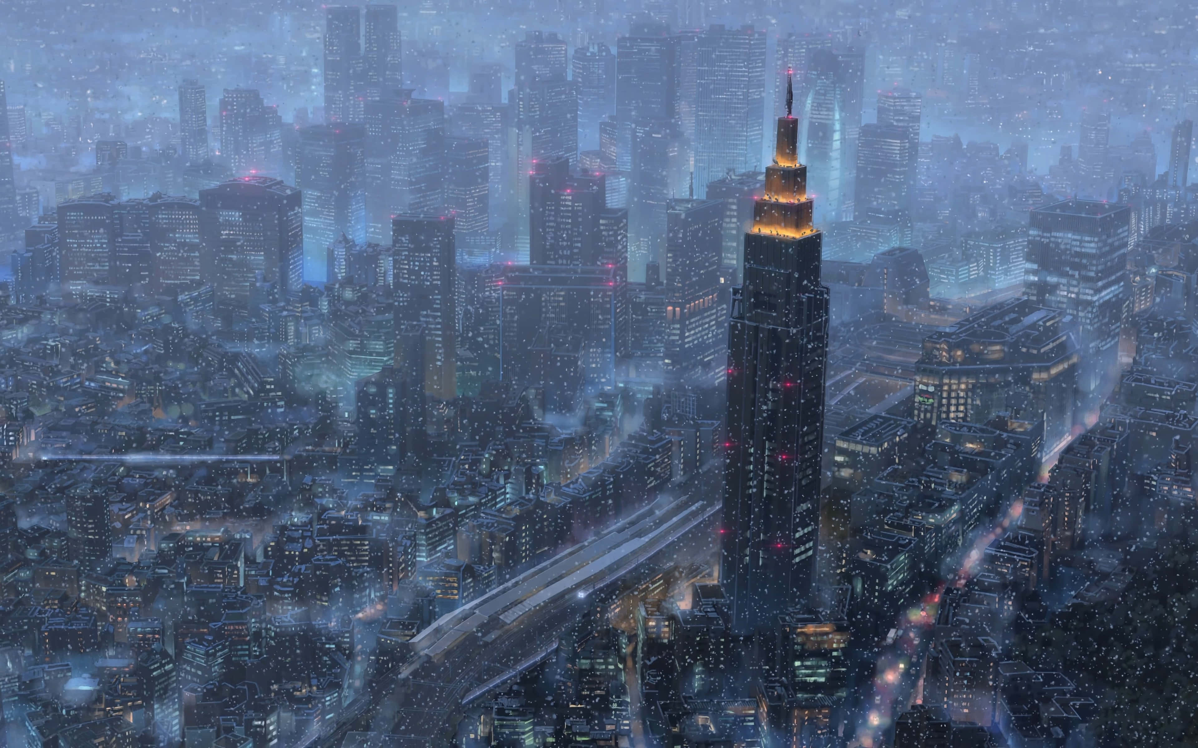 Makoto Shinkai 桌布 壁紙 — 被雪覆蓋的未來主義城市夜景，一座高聳的摩天大樓在周圍建築物冰冷的藍色光芒中溫暖地發光。