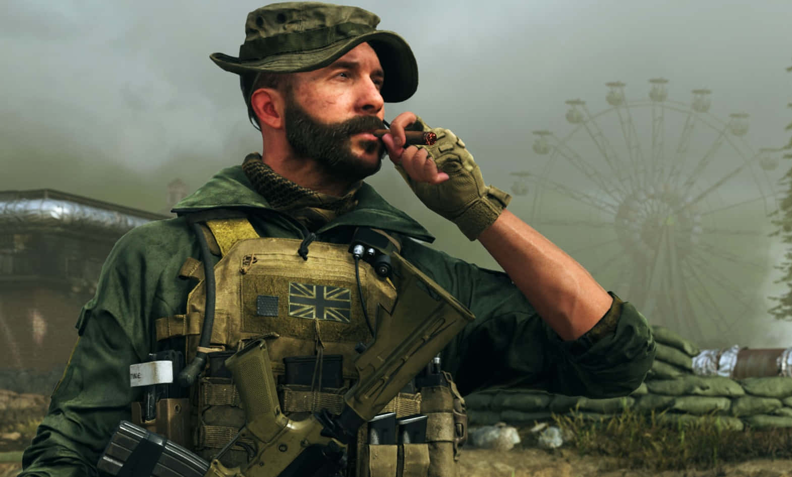 裝備齊全，火力全開！Call of Duty 火力裝備 壁紙 — 一名留鬍鬚的士兵身穿軍裝，在沙包附近抽煙，背景有霧氣中褪色的摩天輪。
