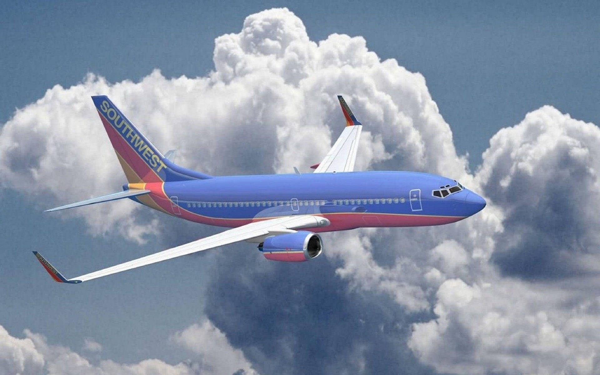 西南航空飛機在藍天白雲上方飛行。
