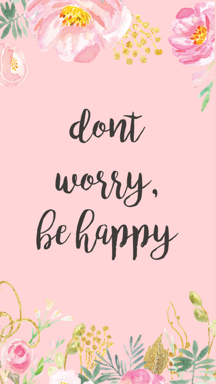 帶有金色點綴和短語 dont worry be happy 的粉紅色花卉壁紙。