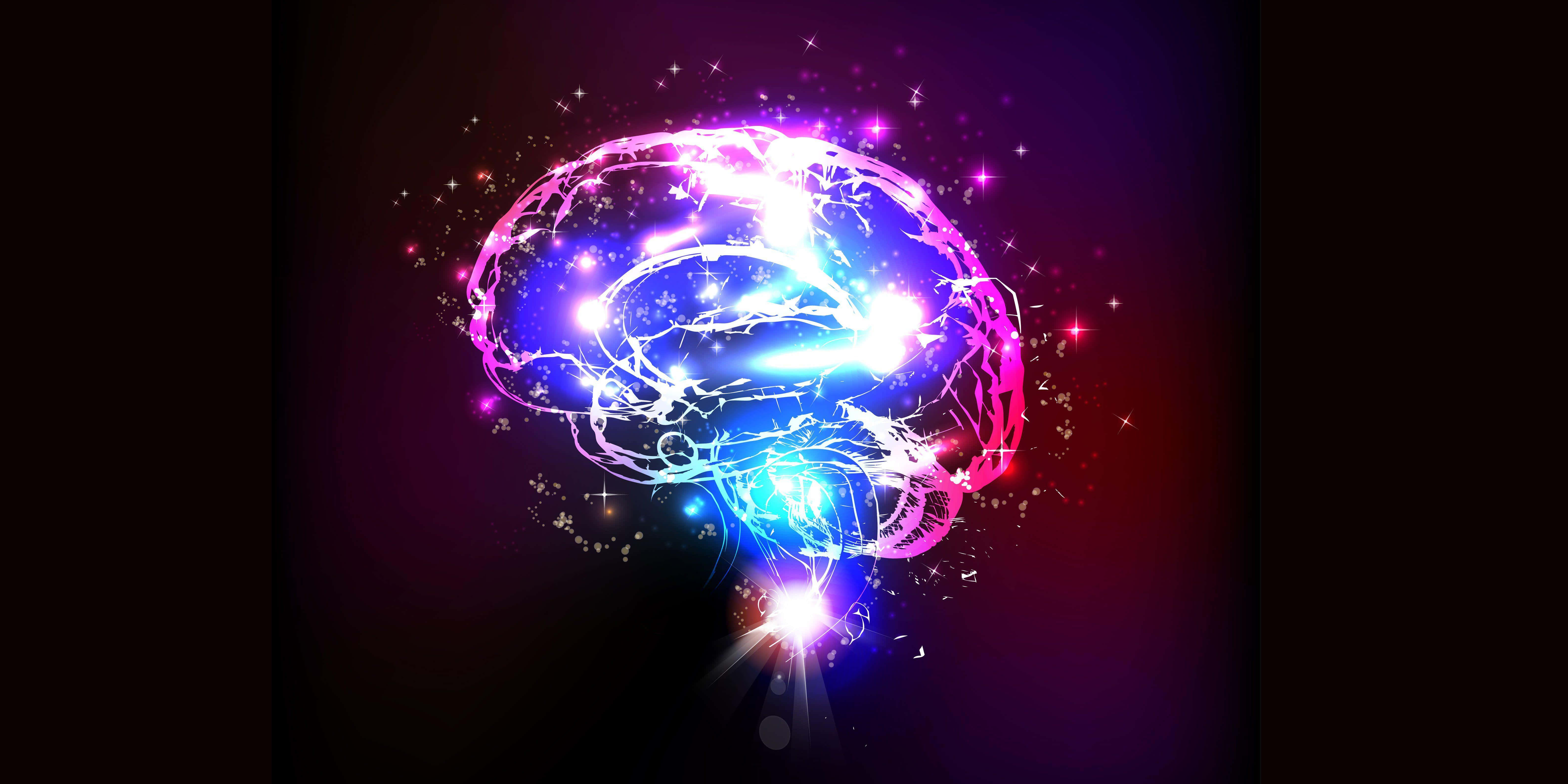 解鎖你大腦的潛能 壁紙 — 一個發光的大腦在黑暗的宇宙背景下散發出電光藍色和粉紅色的能量，並伴有閃爍的星星。