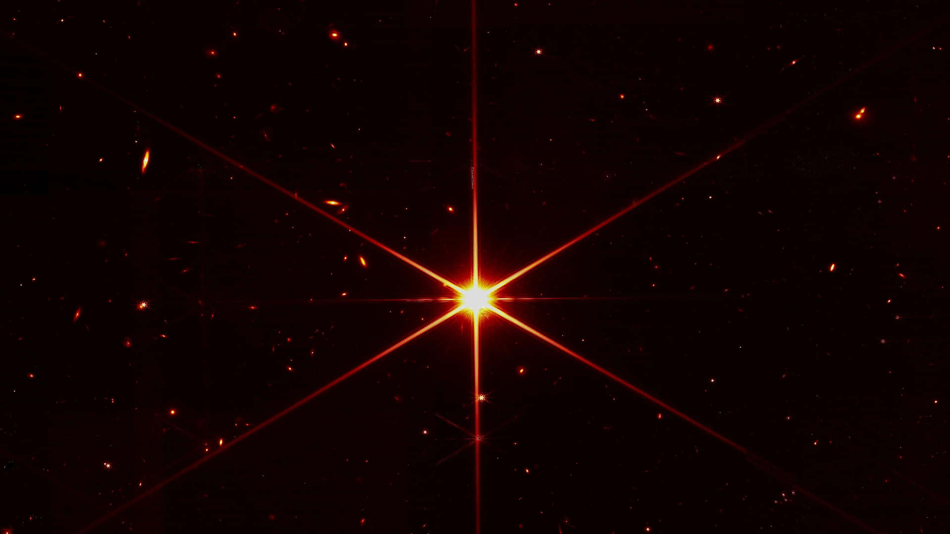 在黑暗的星系空間中，一顆明亮的橙色恆星帶有星爆光線。
