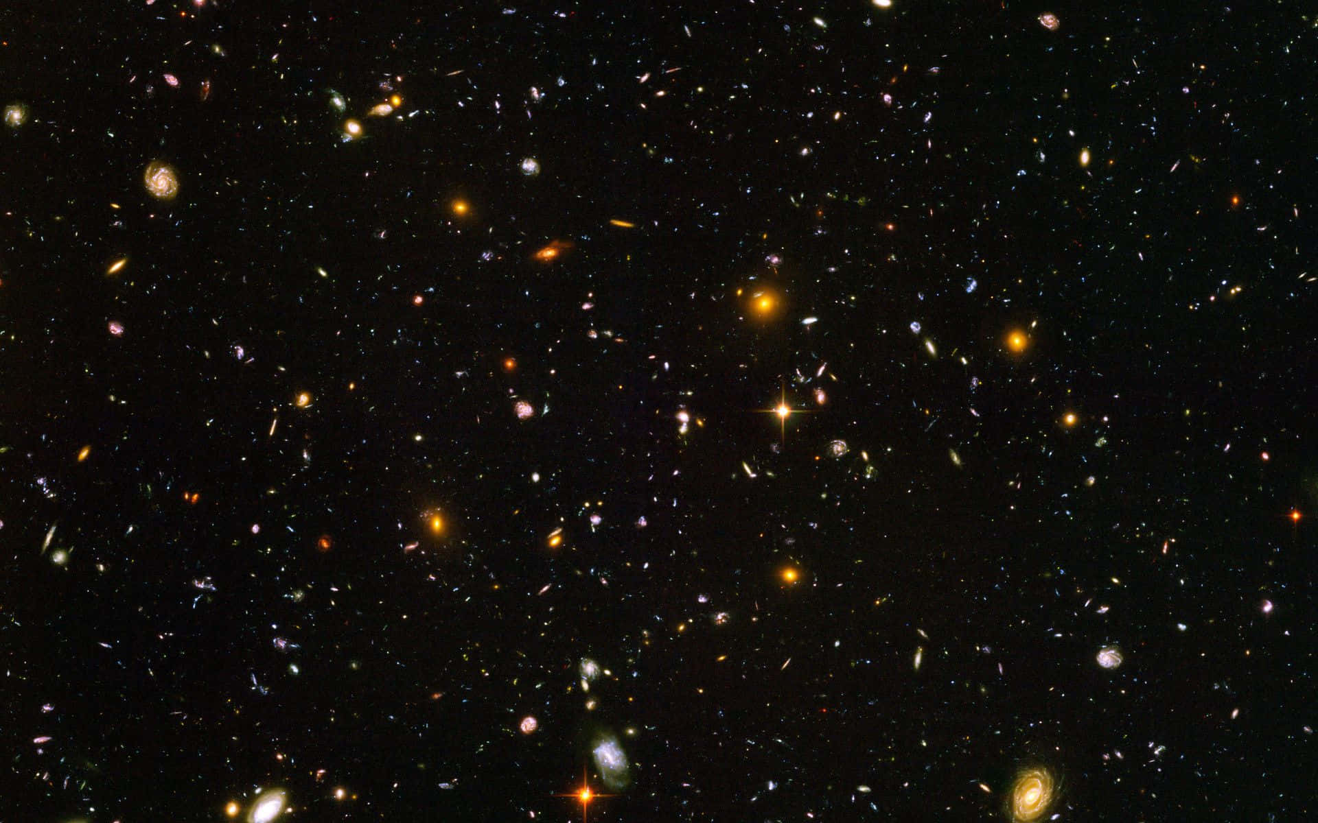廣闊的宇宙場域，充滿了遙遠的星系和明亮的恆星，映襯著黑暗的虛空。