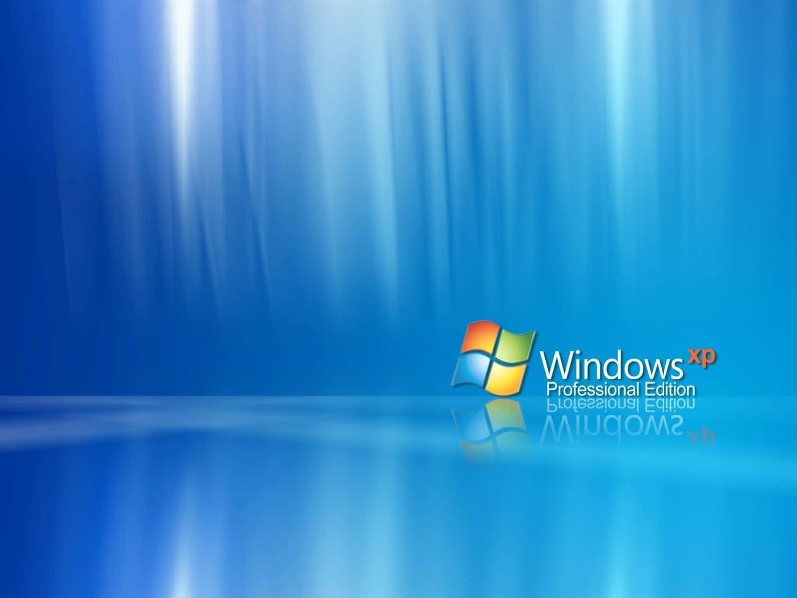 認識 Windows XP 壁紙 — Windows XP Professional Edition 標誌放置在光滑的藍色表面上，上方有輻射光束傾瀉而下。