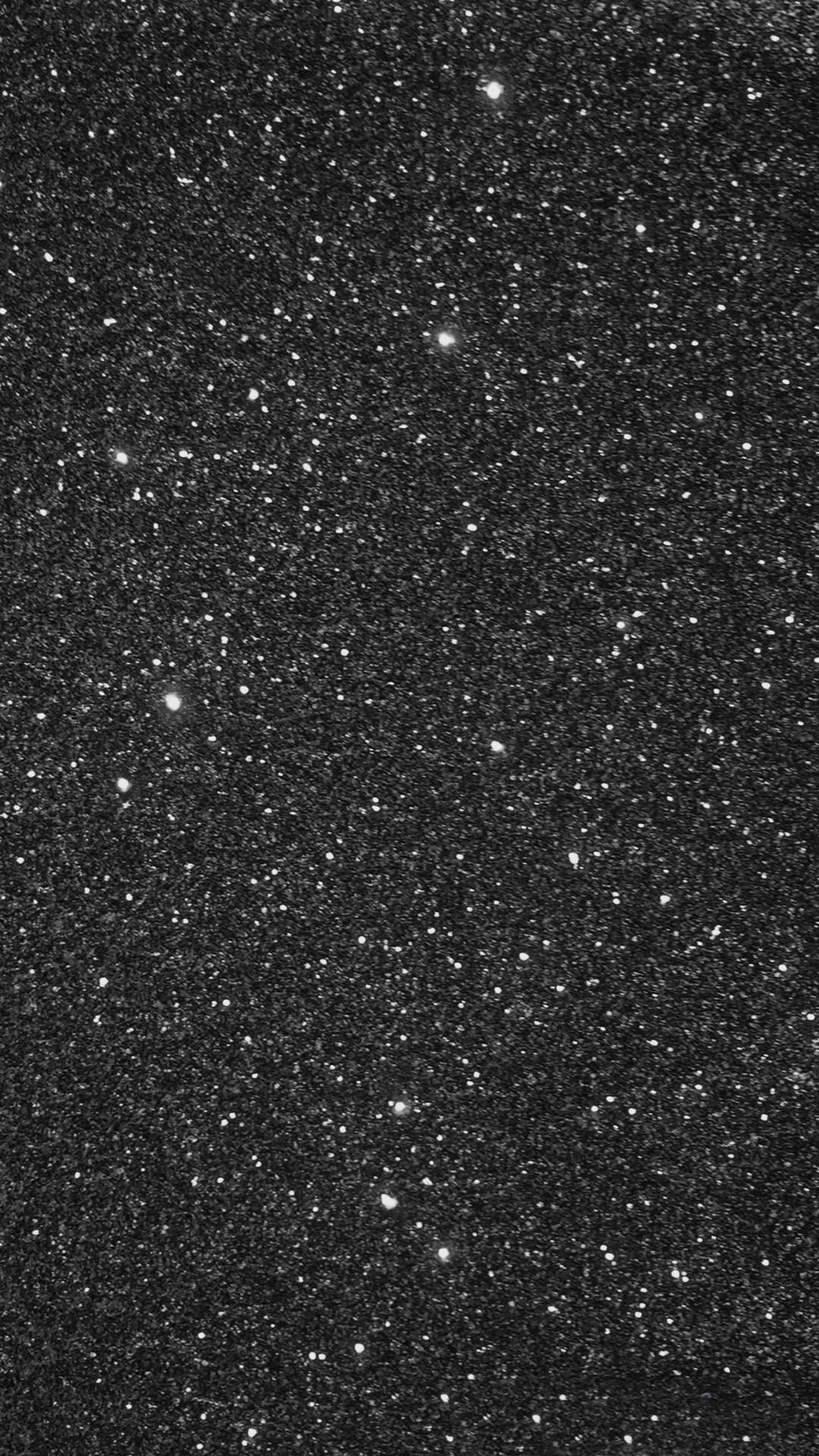 黑色背景上佈滿閃爍白色星星的星空夜空。