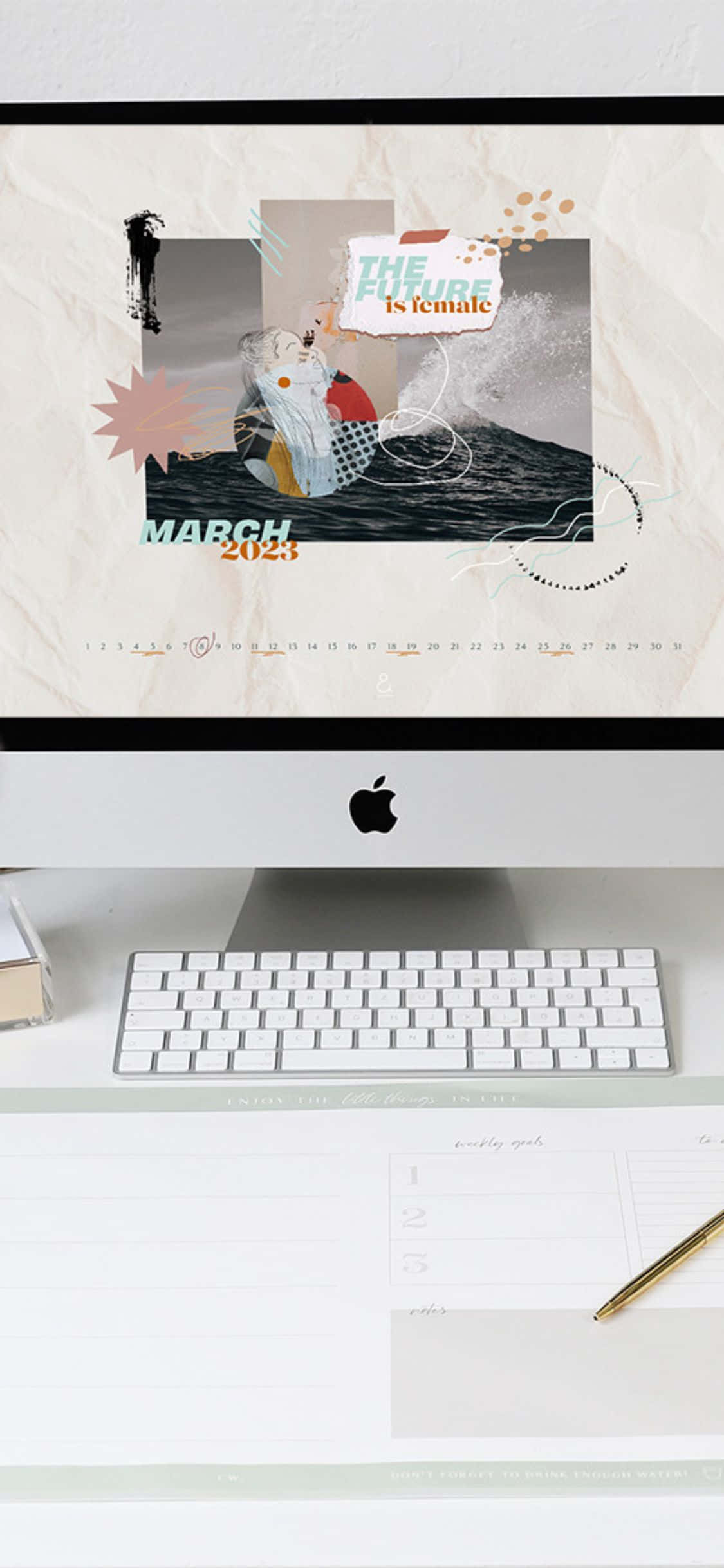 極簡風格的桌面桌布，帶有女性主義日曆和 Apple iMac 設置。