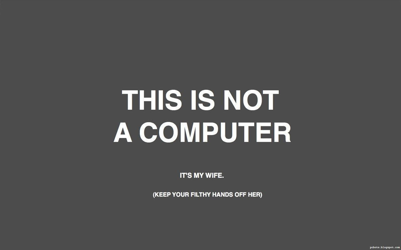 文字圖形，顯示「THIS IS NOT A COMPUTER」，下方有較小文字。 — 黑客 壁紙