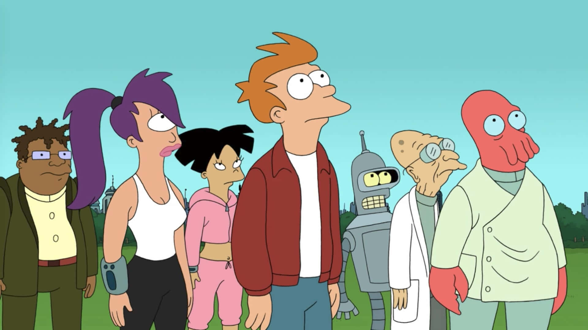 Futurama 角色站在草地上，背景有城市天際線。