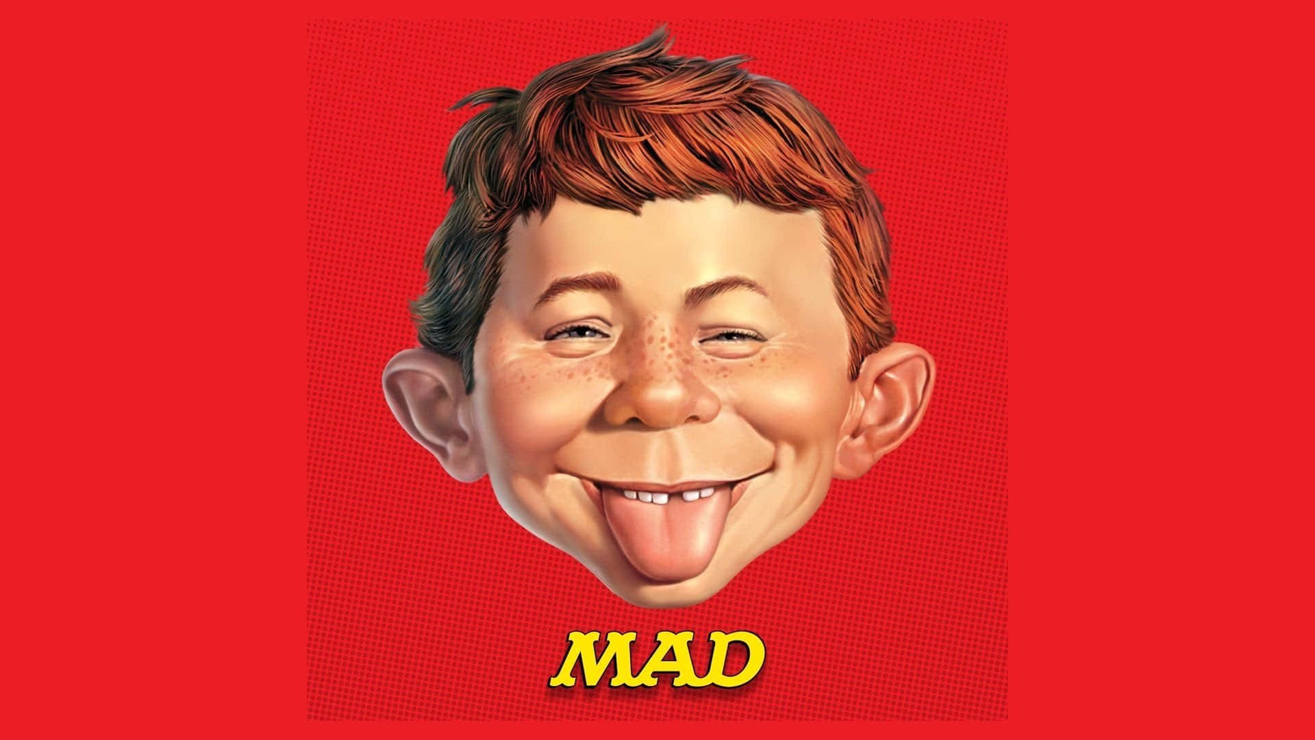有雀斑的卡通男孩在紅色背景上伸出舌頭，並帶有黃色MAD文字。