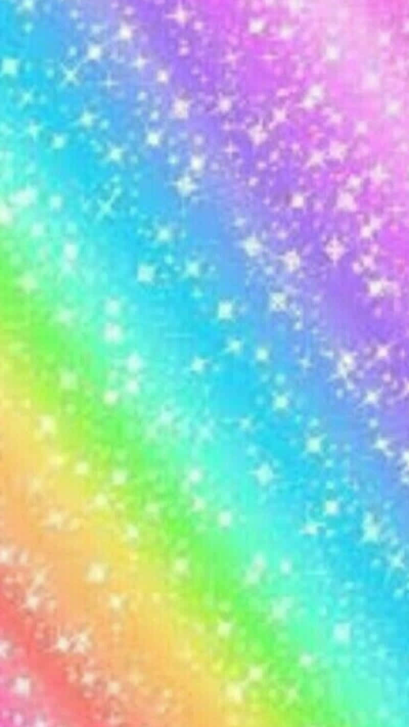 讓彩虹之美為您帶來歡愉 壁紙 — 充滿閃爍白色星星的鮮豔彩虹漸變天空，營造出神奇的宇宙效果。