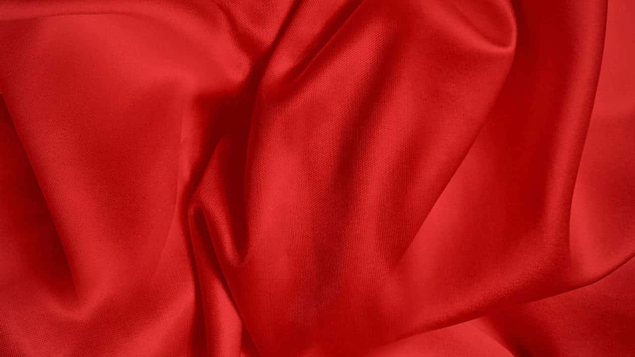 1280x720 桌布 壁紙 — 豐富的紅色緞面布料，帶有深褶皺和柔和亮點，營造出奢華質感。
