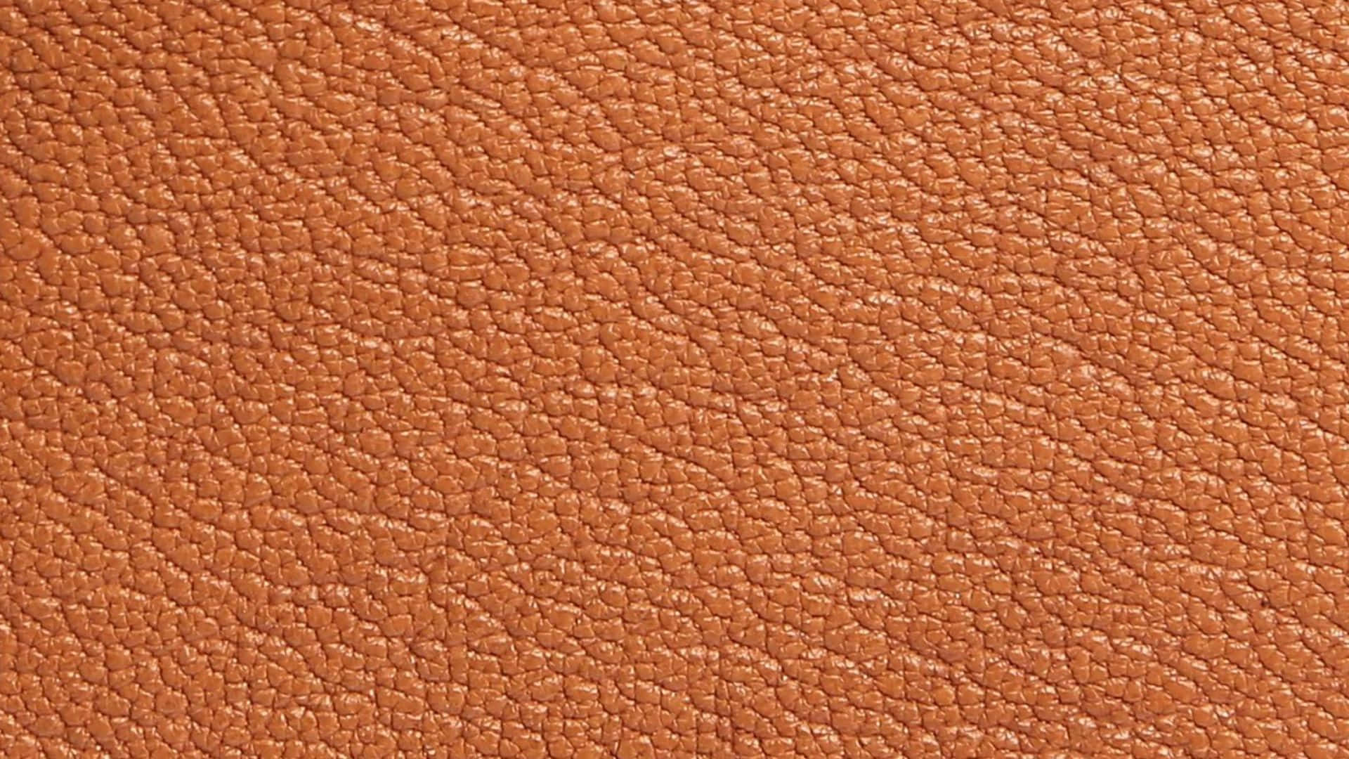 Brown Leather 桌布 壁紙 — 豐富的赤陶棕色卵石紋皮革質感特寫，帶有天然紋理圖案。