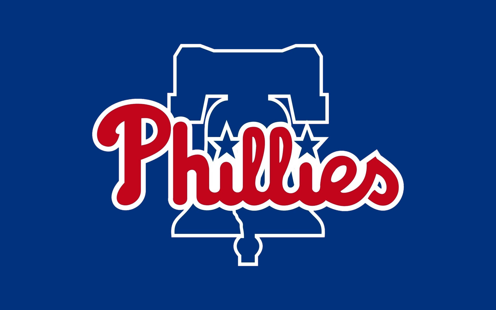 費城費城人棒球隊官方標誌 壁紙 — 大膽的紅色 Phillies 字體，帶有白色輪廓和藍色星星，置於純皇家藍色背景上。
