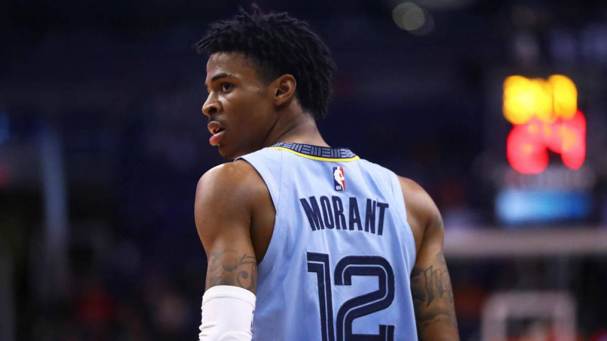 Ja Morant在籃球比賽中身穿淺藍色12號球衣。 — 莫蘭特 壁紙