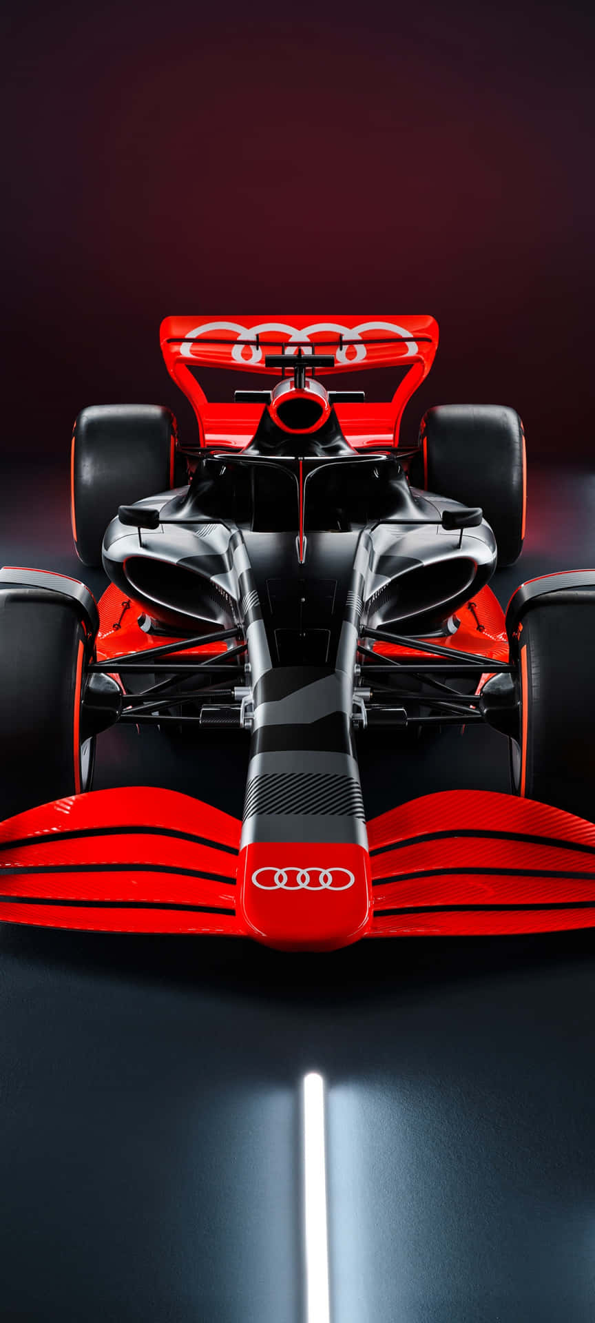 工作室中發光的紅色和黑色奧迪F1賽車。