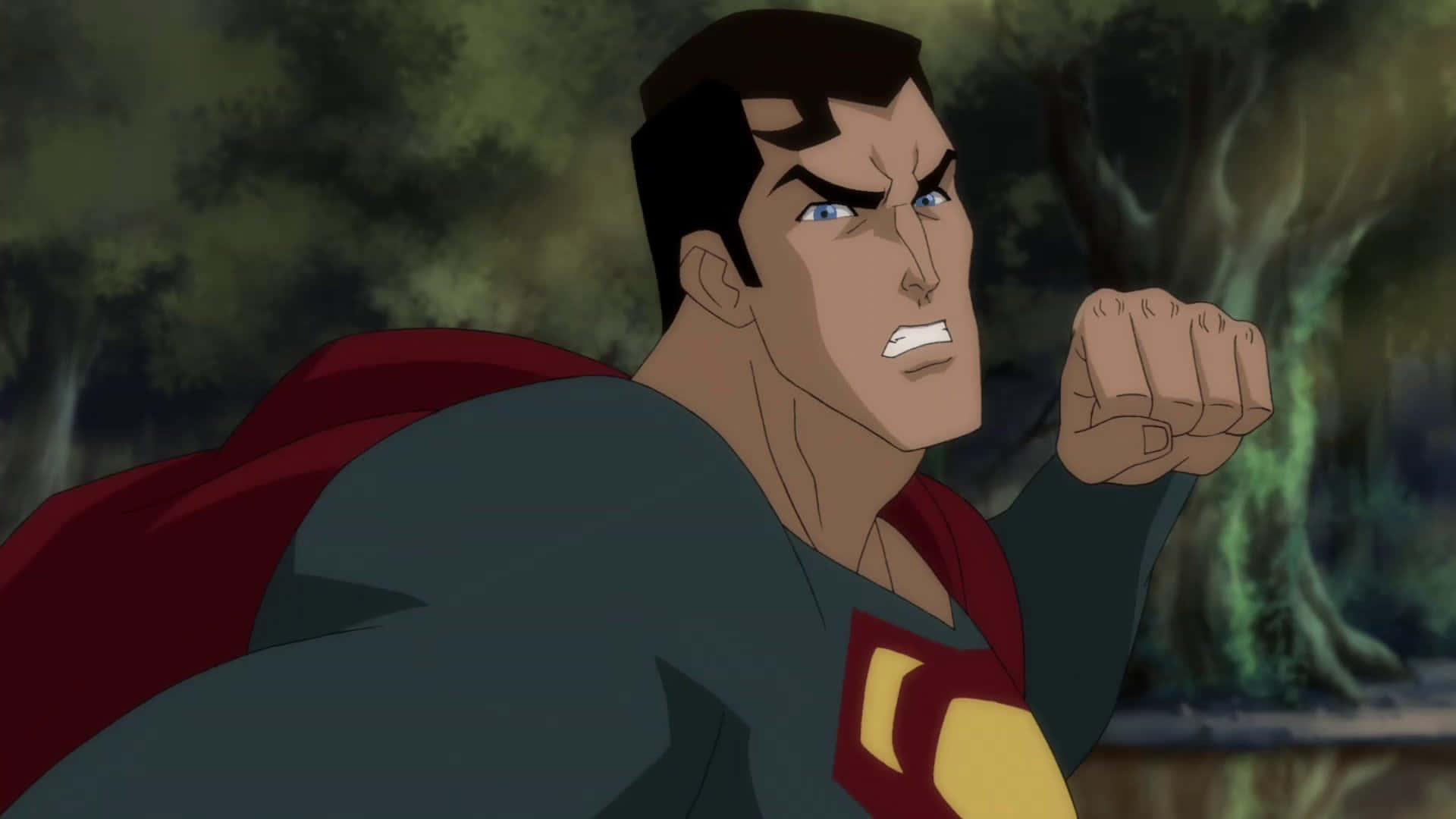 Superman Unbound 桌布 壁紙 — 超人喺黑暗森林入面握緊拳頭，表情兇猛。