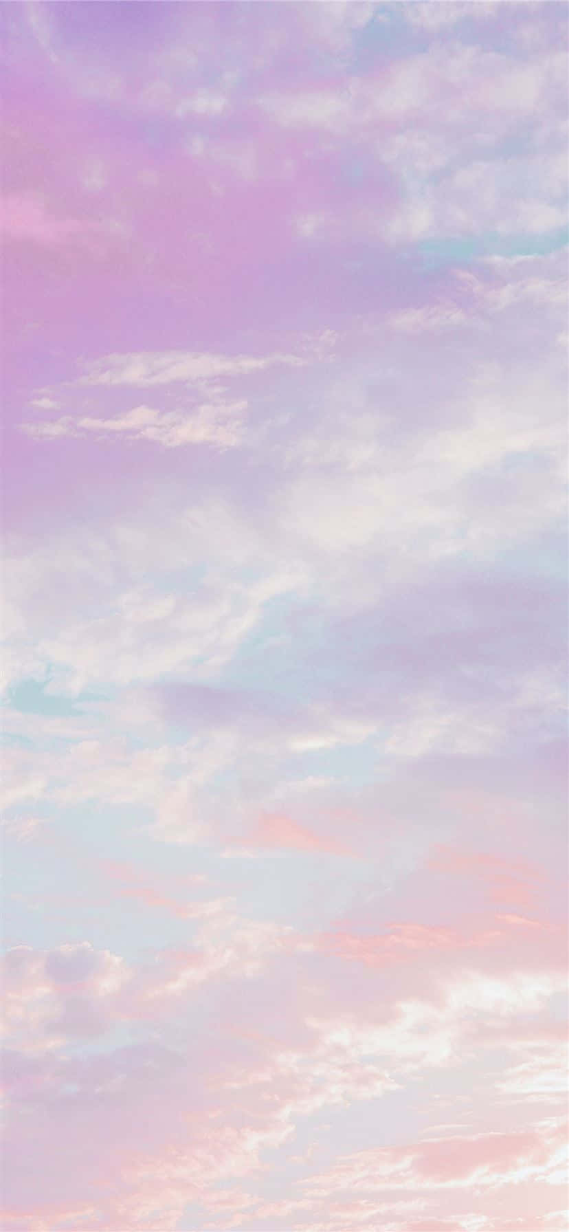 粉彩粉紅、薰衣草和藍色天空，帶有輕柔雲朵