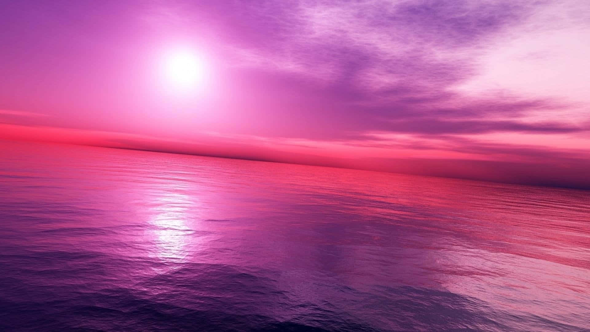 Pink Sky 桌布 壁紙 — 超現實的海洋日落，沐浴在鮮豔的粉紅色和紫色色調中，發光的太陽映照在平靜的水面上。