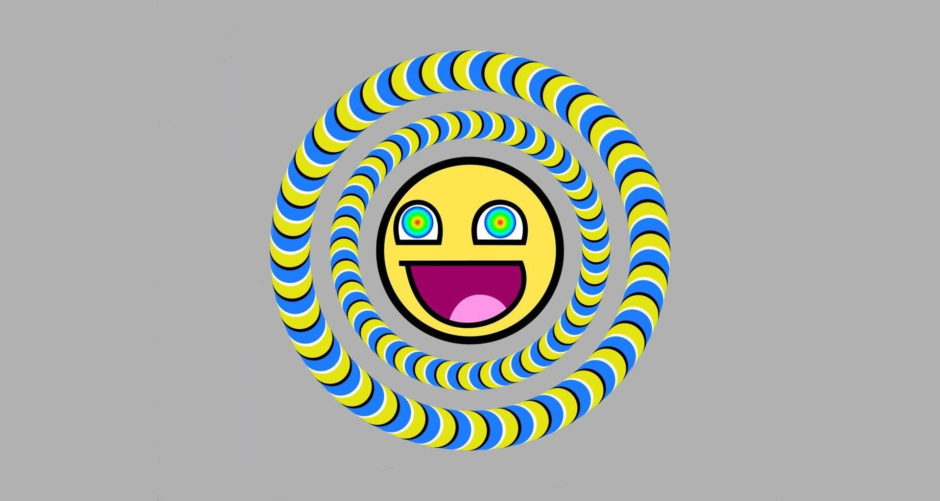 一個微笑的表情符號，被灰色上旋轉的藍色和黃色圖案包圍。