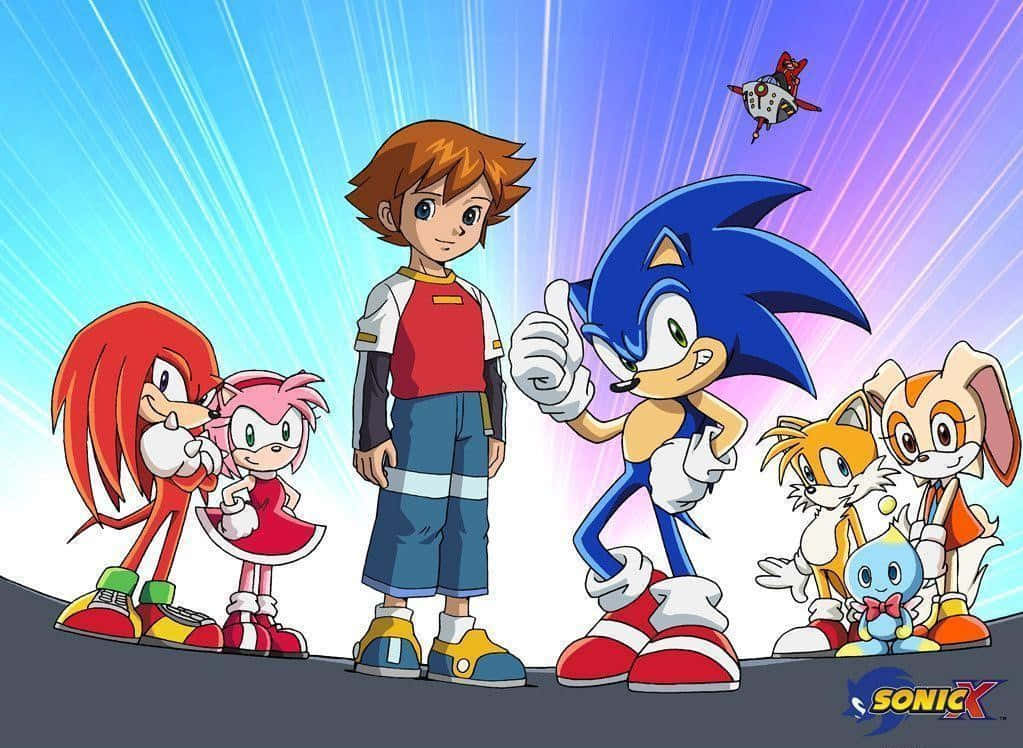 Sonic X 桌布 壁紙 — 超音鼠和他的朋友們一起站在充滿活力的動漫風格場景中，有動態光線和漂浮的機械人。