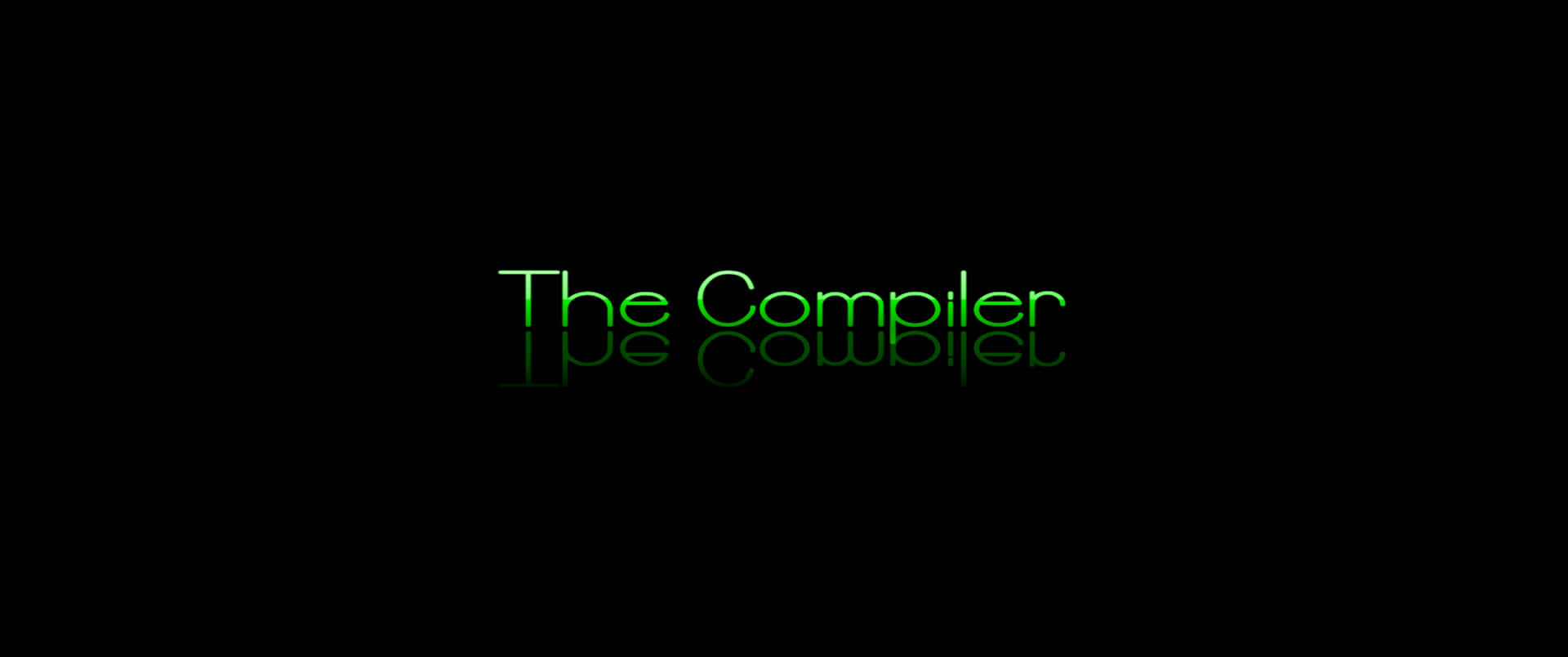 綠色發光文字，顯示 The Compiler，在黑色背景上帶有鏡面反射