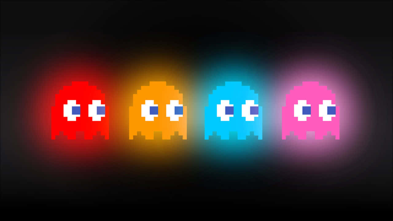 來自 Pac-Man 遊戲的四個發光像素鬼魂，顏色為紅色、橙色、藍色和粉紅色。