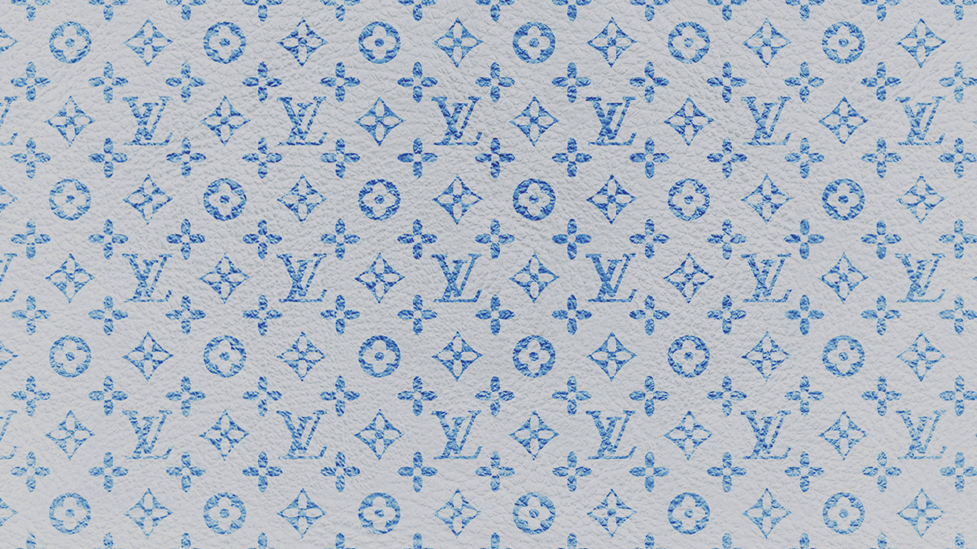 紋理灰色布料背景上的藍色字母組合圖案。