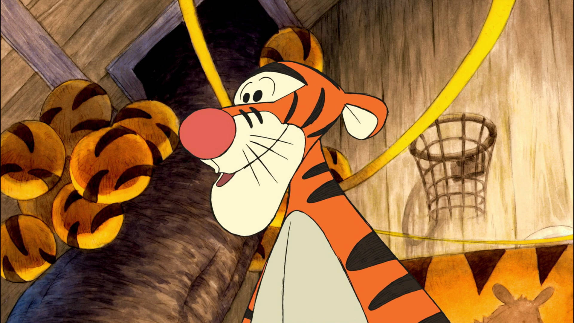 跳跳虎毛球 壁紙 — Tigger 喺一個充滿老虎毛公仔同籃球框嘅木製遊戲室入面開心跳嚟跳去。