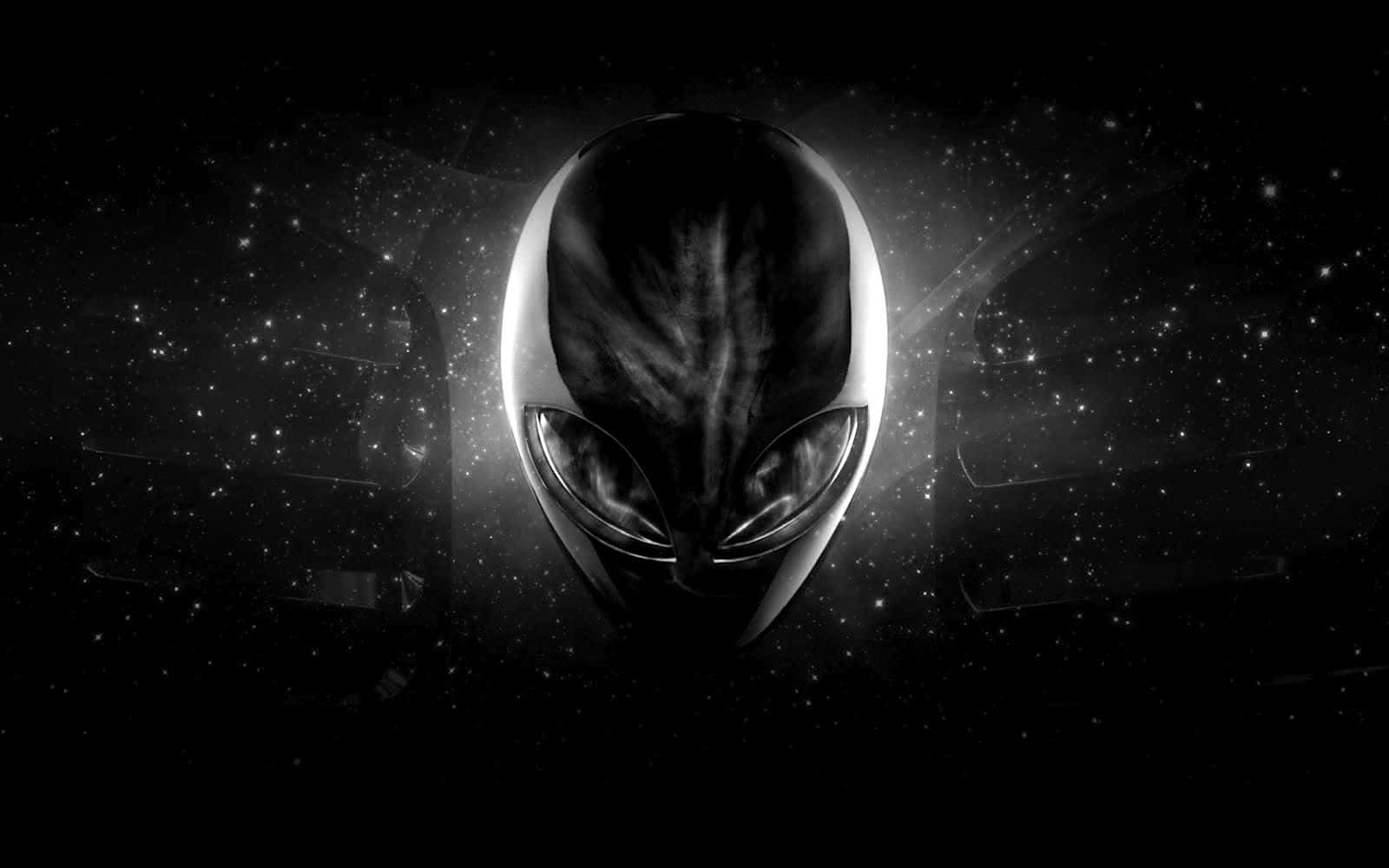 踏入未知 壁紙 — 一個時尚的外星人頭部在星光宇宙背景中發光，帶有微妙的光暈。