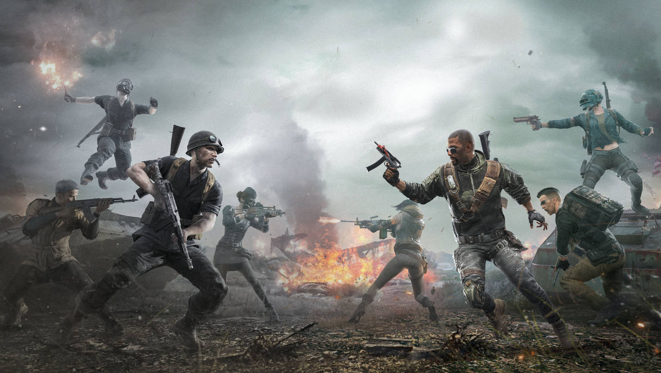 PUBG 桌布 壁紙 — 身穿戰鬥裝備的士兵在風暴天空下，衝過佈滿爆炸和煙霧的烈火戰場。