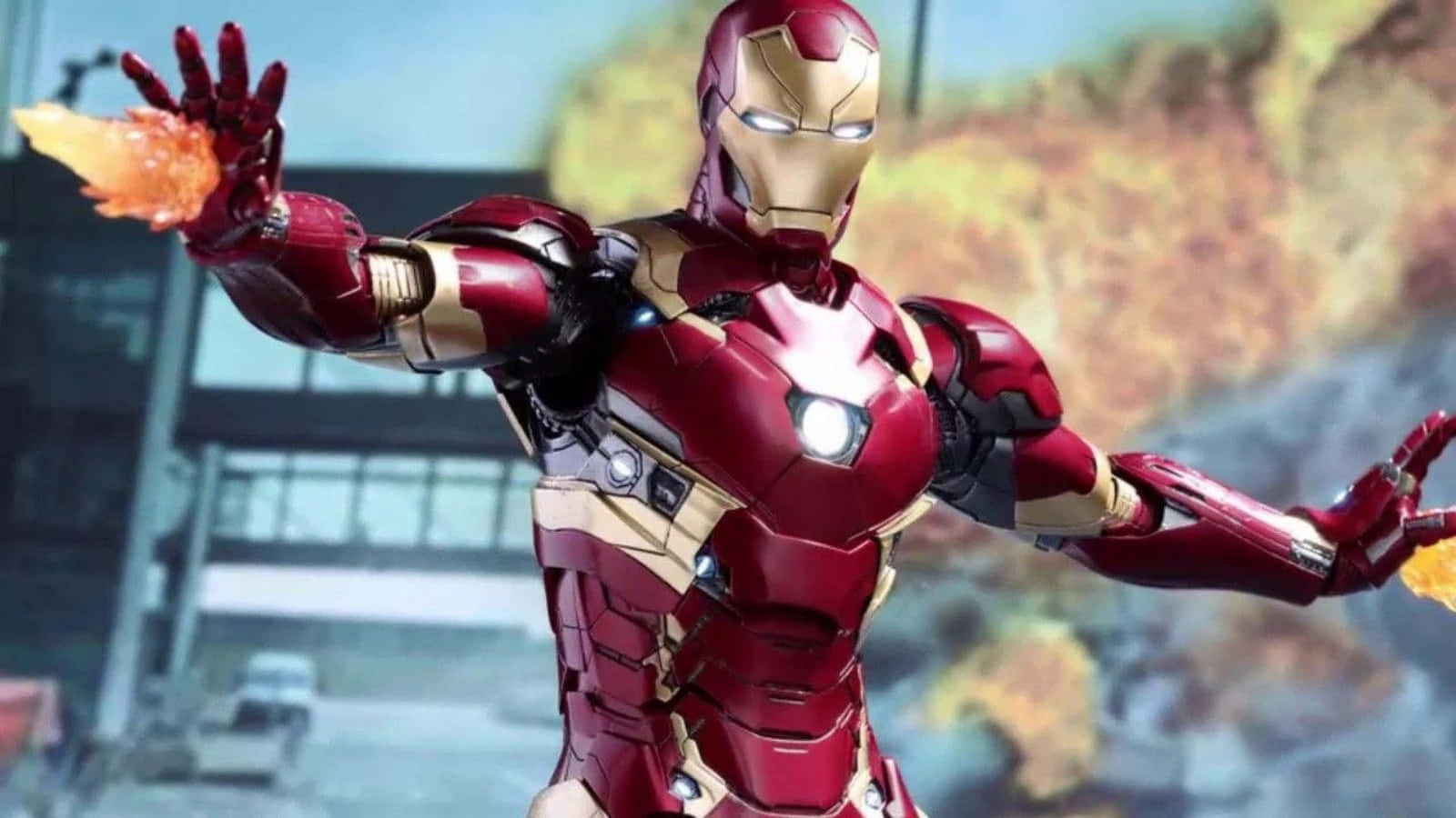Vibranium Suit 桌布 壁紙 — 身穿紅色和金色盔甲的鐵甲奇俠，在模糊的城市背景下從雙手發射斥力光束。