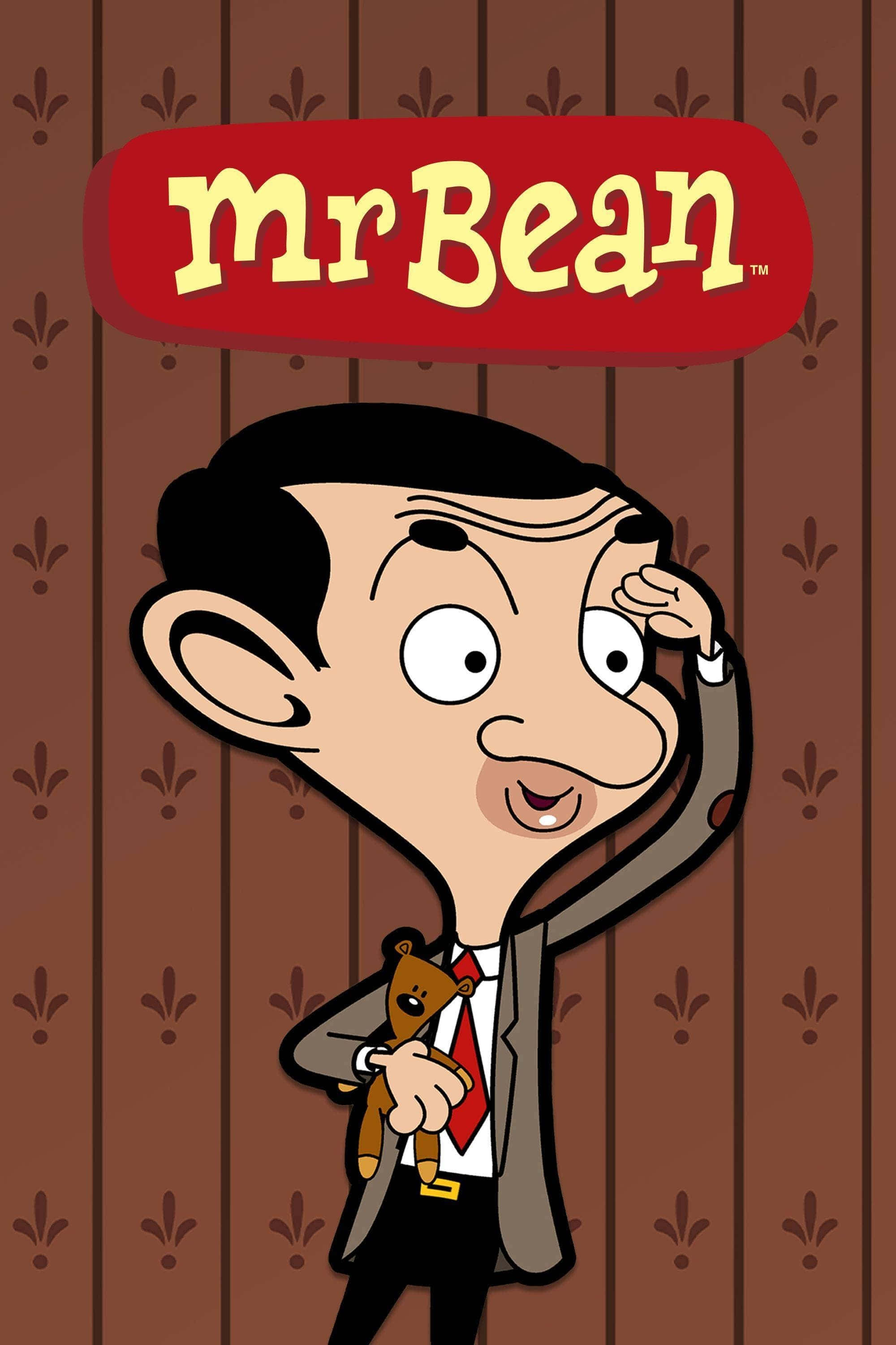 Mr Bean 桌布 壁紙 — 身穿西裝的Mr Bean卡通角色，在圖案棕色牆紙背景前抱著泰迪熊。