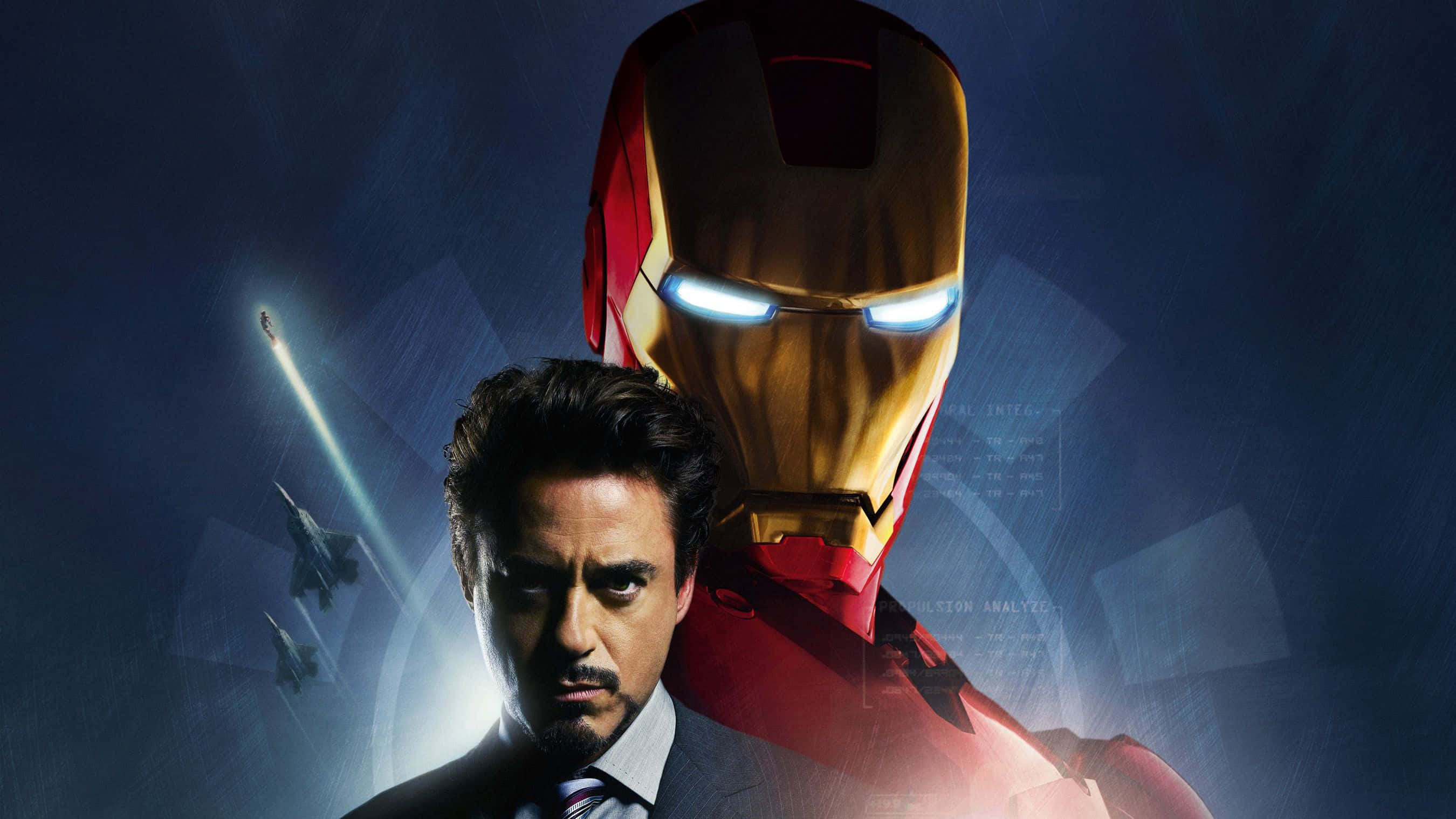 Iron Man Movies 桌布 壁紙 — 身穿西裝的東尼·史塔克站在發光的鐵甲奇俠頭盔前，背景是深藍色，有戰鬥機飛過。