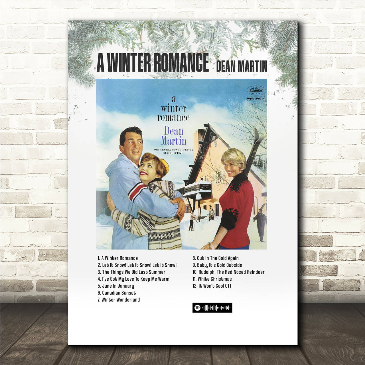 迪恩·馬丁復古歌曲封面 壁紙 — Vintage Dean Martin 專輯封面《A Winter Romance》裱框在白色磚牆上，搭配松樹枝。