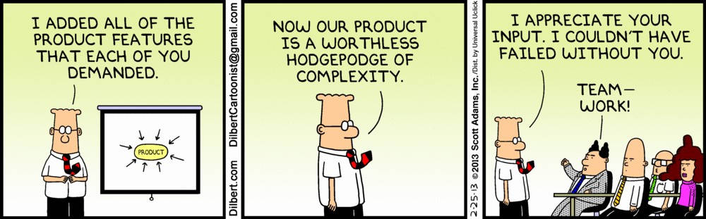Dilbert 向他的團隊展示了一個複雜的產品，團隊為他的「團隊合作」而歡呼。