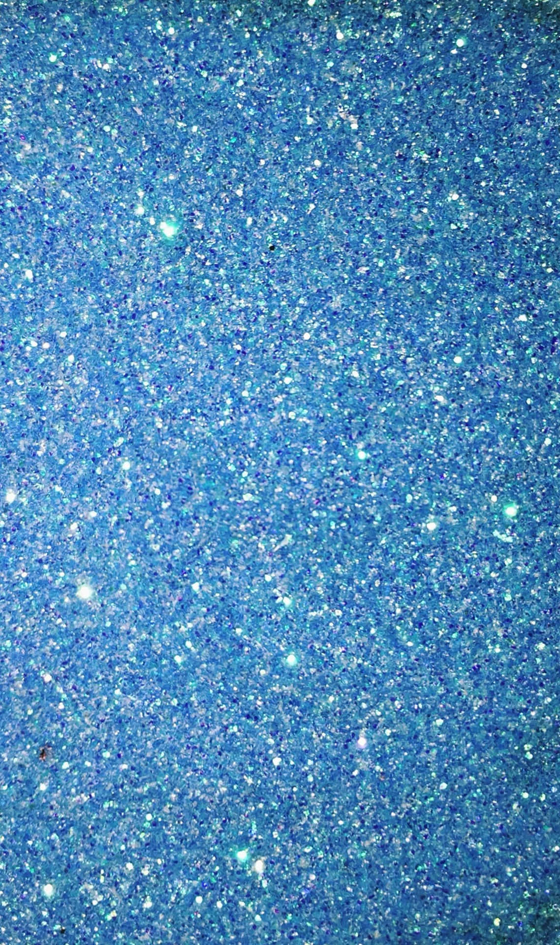 帶有閃爍顆粒的藍色閃粉背景