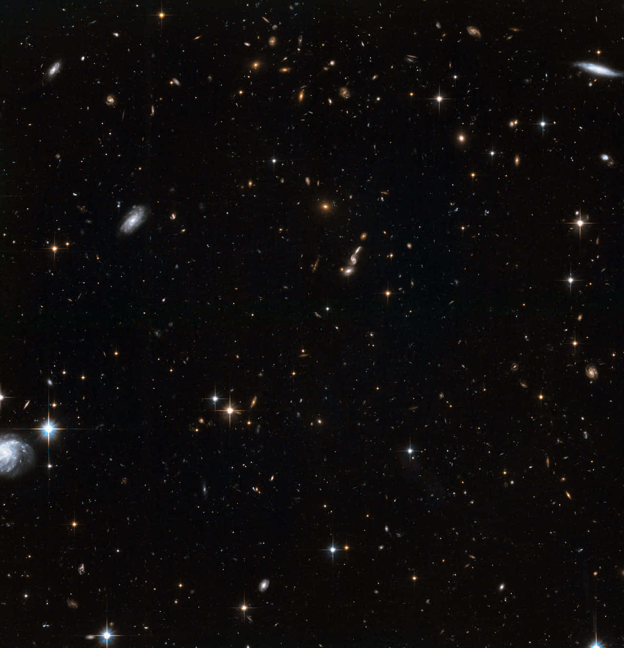 廣闊的宇宙空間，恆星和星系散落在黑暗的宇宙中。