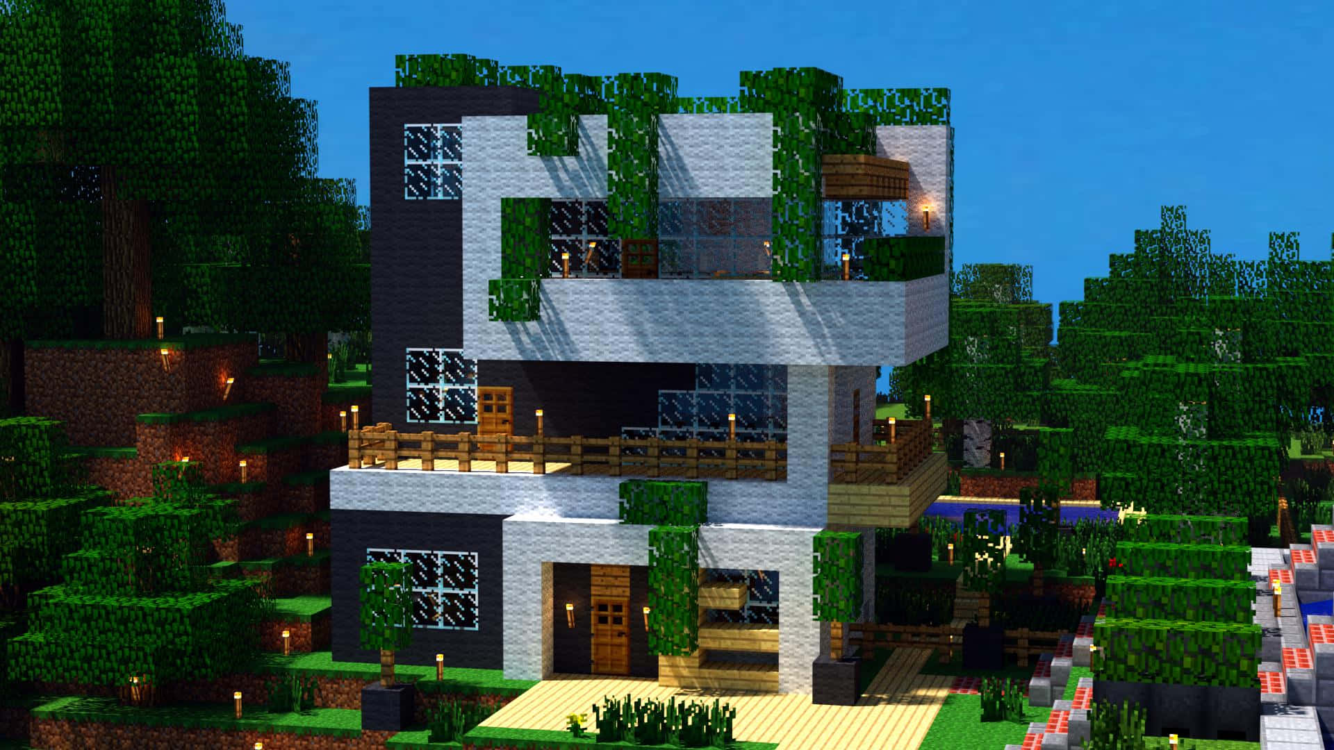 Minecraft森林中的現代方塊房屋，帶有發光燈具和玻璃窗。
