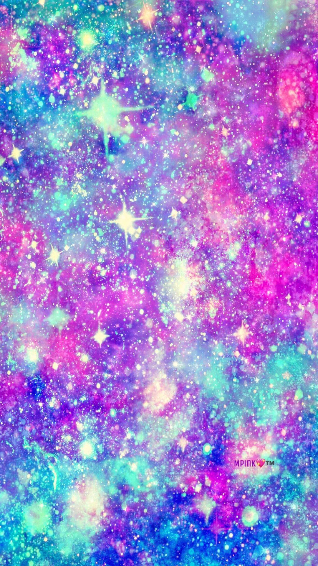 充滿活力的宇宙星雲，帶有閃爍的粉紅、藍綠色和紫色星星。 — 可愛星系 壁紙