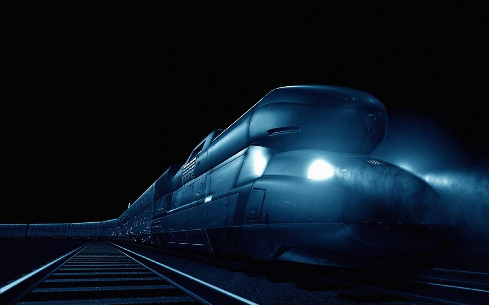 一輛高速列車帶著明亮的車頭燈在夜間穿過黑暗的隧道。