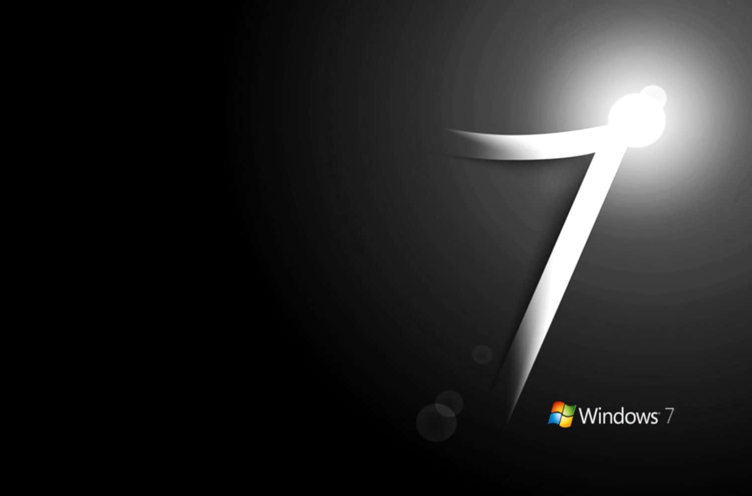 發光白色數字7，在深色背景上帶有光線，並附有Windows 7標誌。