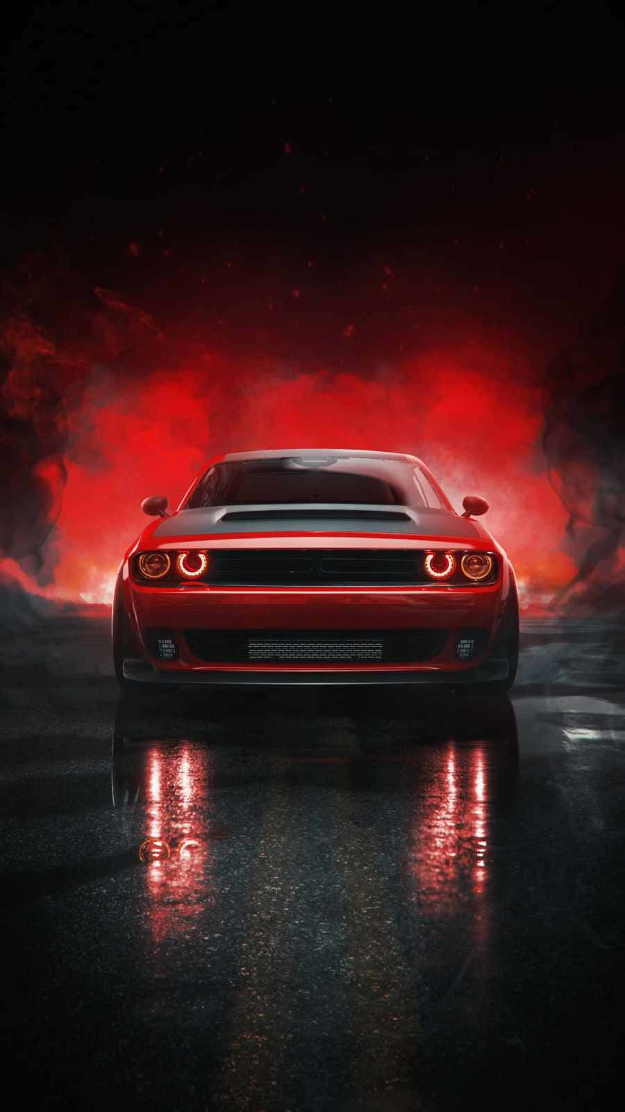 速度與風格兼具的 Hellcat iPhone 壁紙 — 一輛紅色肌肉車在潮濕的道路上向前行駛，在黑暗的天空下，身後冒出火紅色的煙霧。