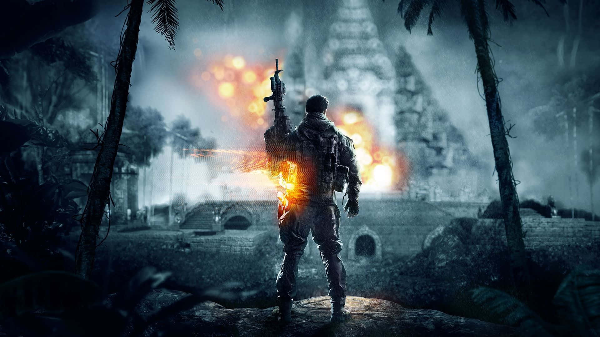 遊戲中的震撼爆炸場景 壁紙 — 一名士兵在夜晚的叢林中開火，爆炸照亮了他身後一座廢墟中的寺廟。